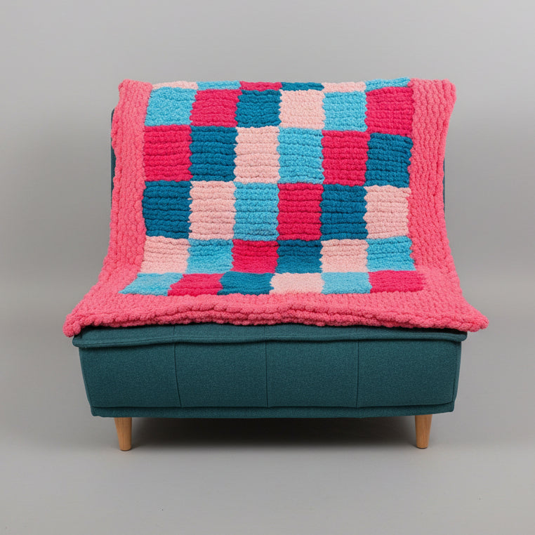 Photo of a patchwork blanket on a chair