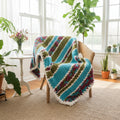 An AI photo of colorful blankie draped on a chair in a sunroom