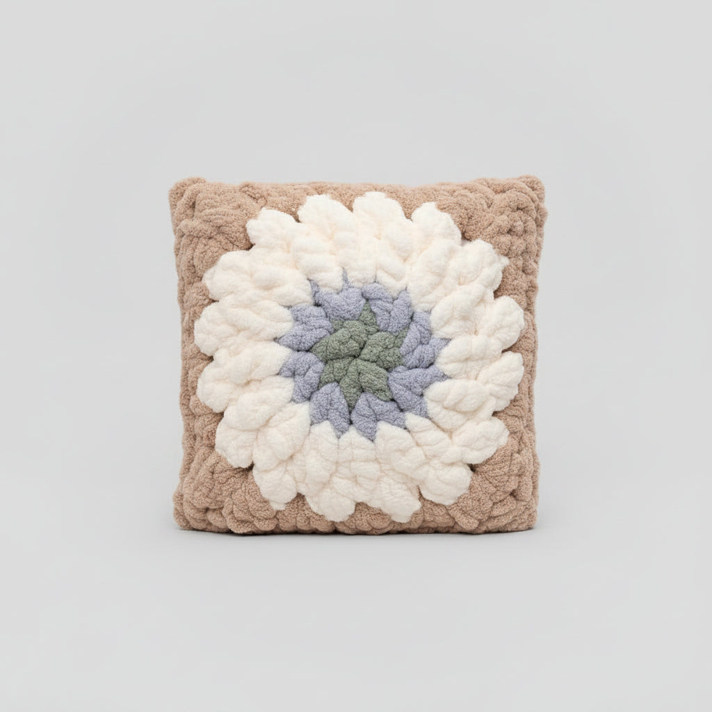 A photo of a granny square pillow