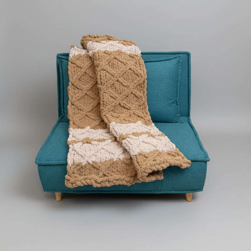 A photo of olive cable lattice blanket draped over teal chair