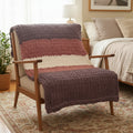 AI generated photo of purple blanket on a wooden chair in a bedroom