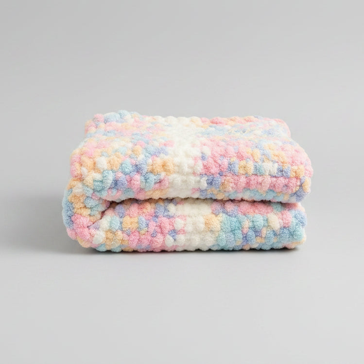 A photo of a folded baby blanket